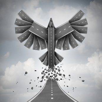 Start up or startup business progress concept as a new company or corporate venture metaphor of success potential as a path or street tranforming into flying wings of opportunity as a 3D illustration.
