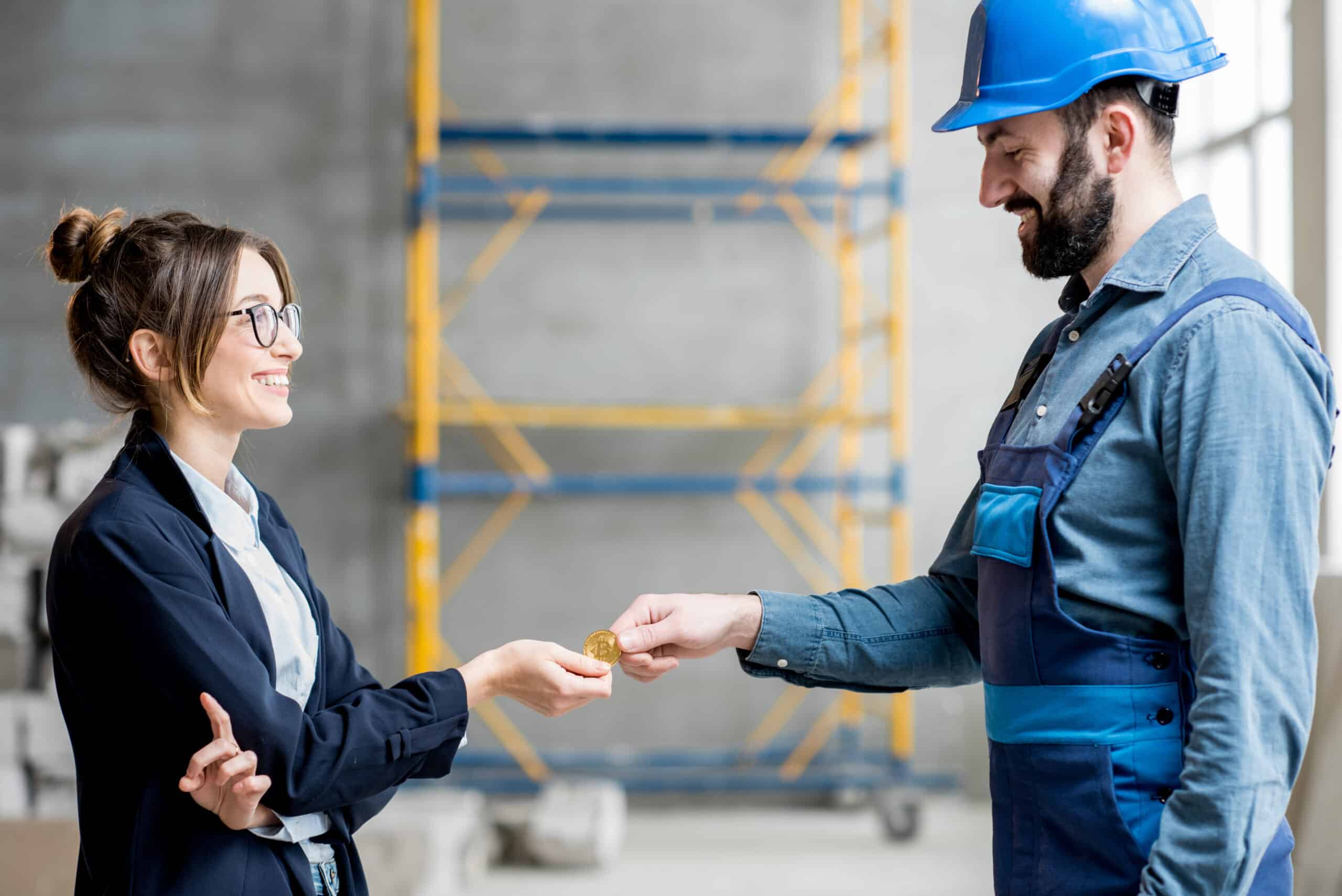 Woman Giving Cryptocurrency To A Builder